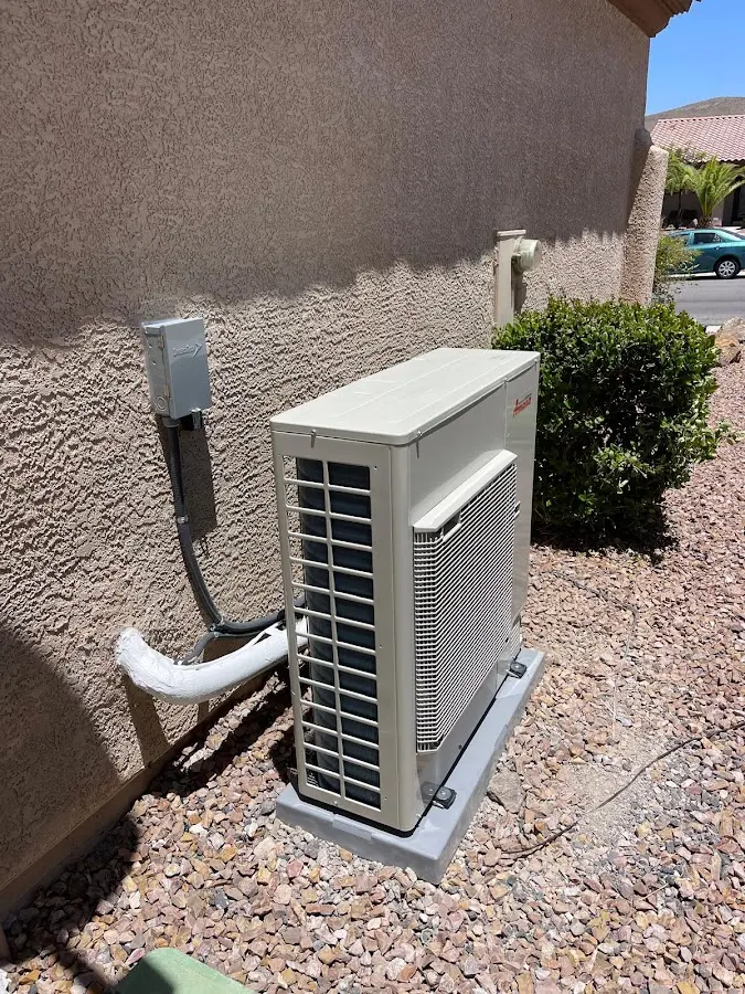 Residential air conditioning condenser unit in Commerce